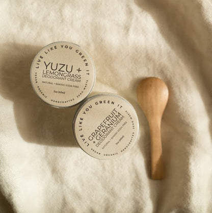 Two jars of natural deodorant with bamboo spoon applicator